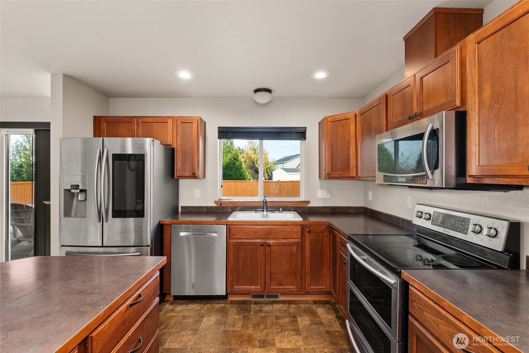 234 Wind River Drive Chehalis, WA 98532 - Photo 9 of 33 a kitchen with stainless steel appliances granite countertop a sink stove and refrigerator