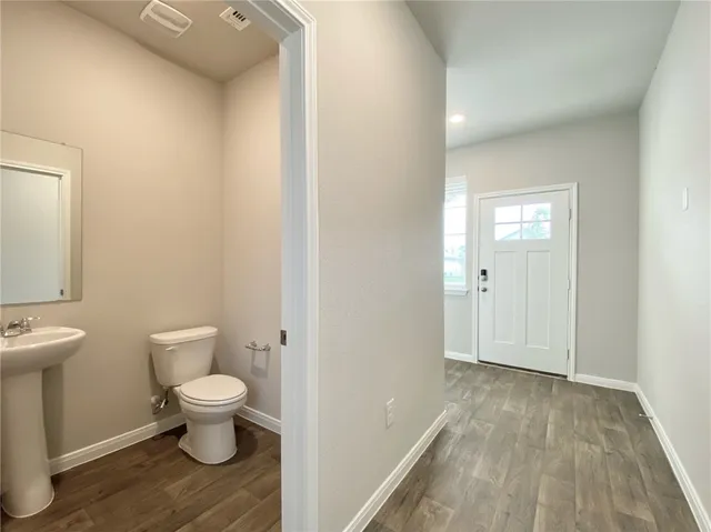 a bathroom with a toilet and a sink