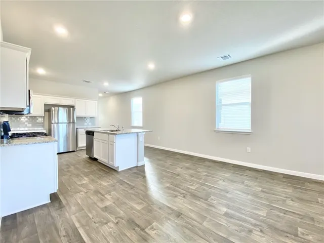 a view of kitchen with wooden floor