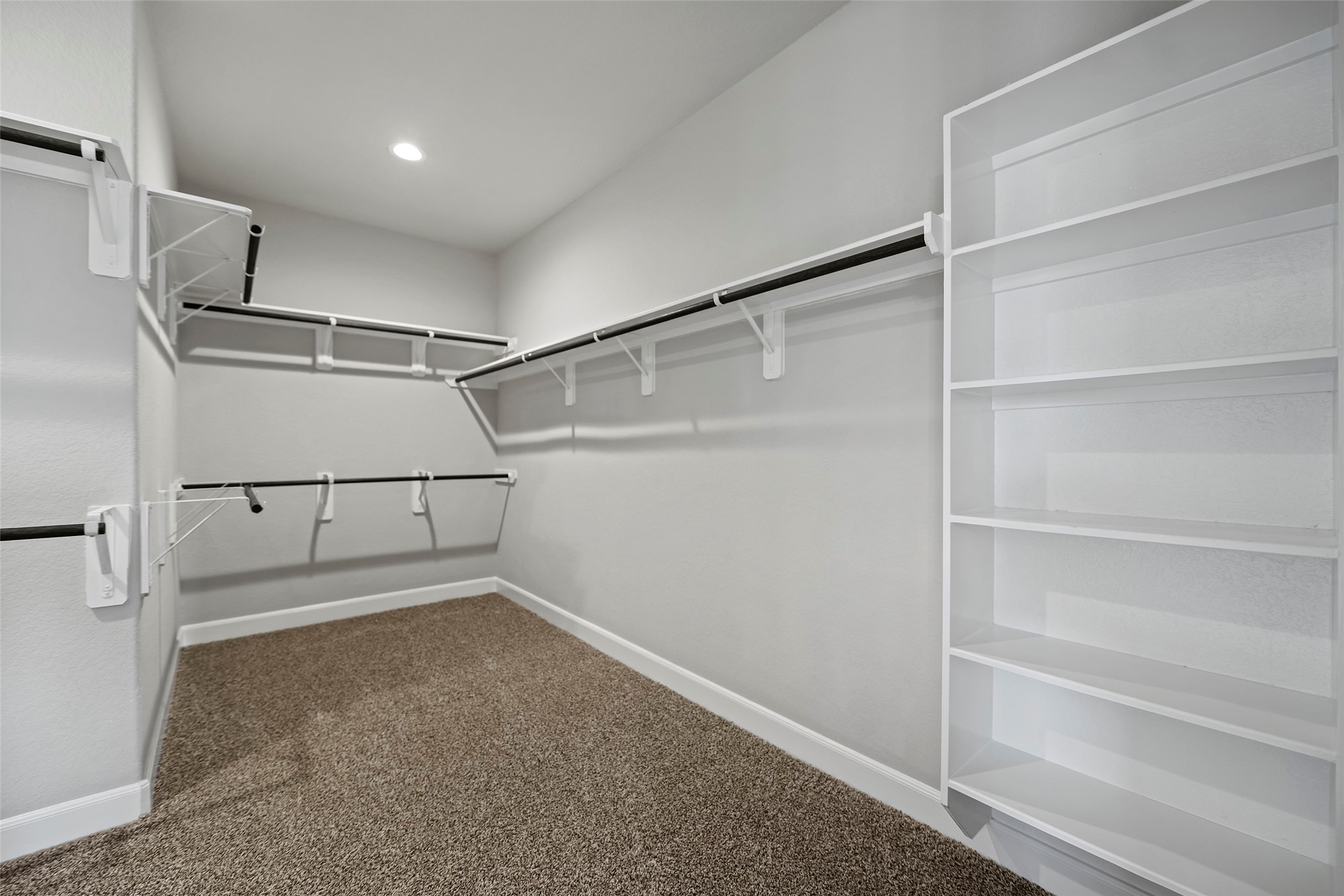 5839 Metaphor Way Rosenberg, TX 77469 - Photo 10 of 50 His and hers closet in the primary room.