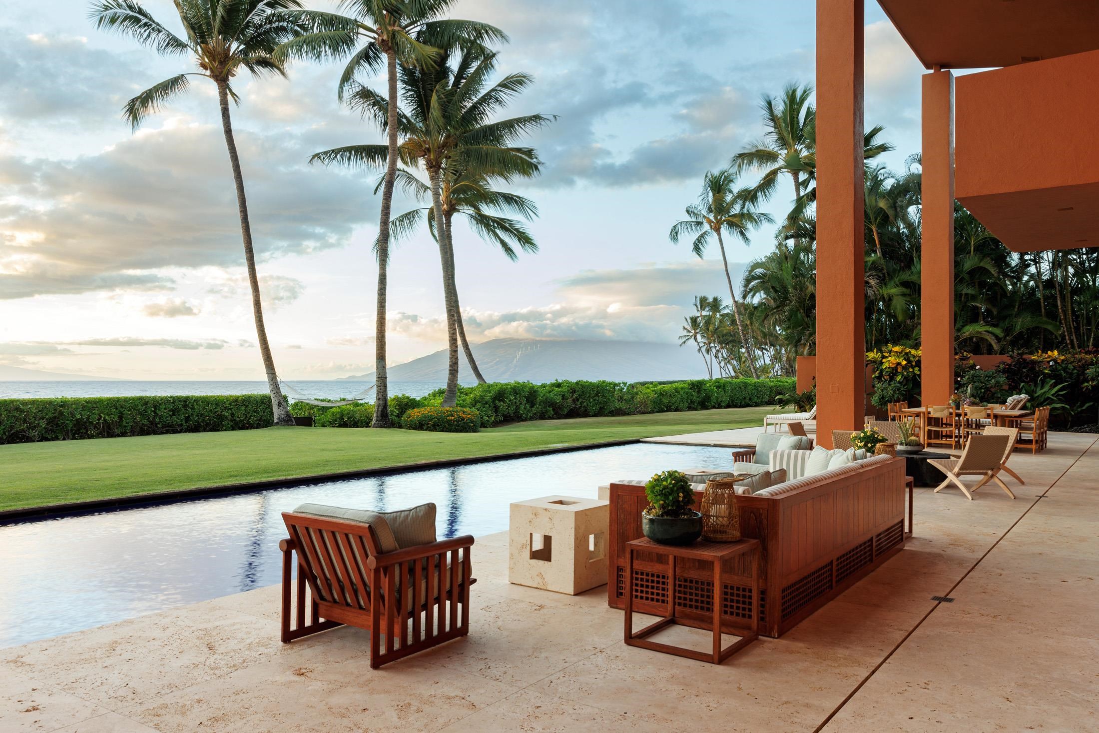 3200 South Kihei Road Kihei, HI 96753 - Photo 19 of 36 a view of a patio with a table chairs and a swimming pool