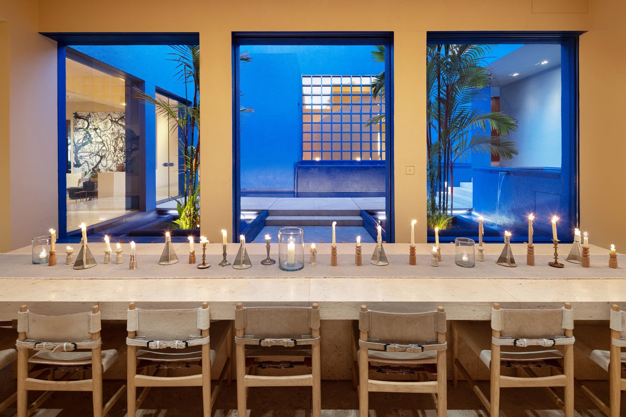 3200 South Kihei Road Kihei, HI 96753 - Photo 10 of 36 a kitchen with a dining table chairs and white cabinets
