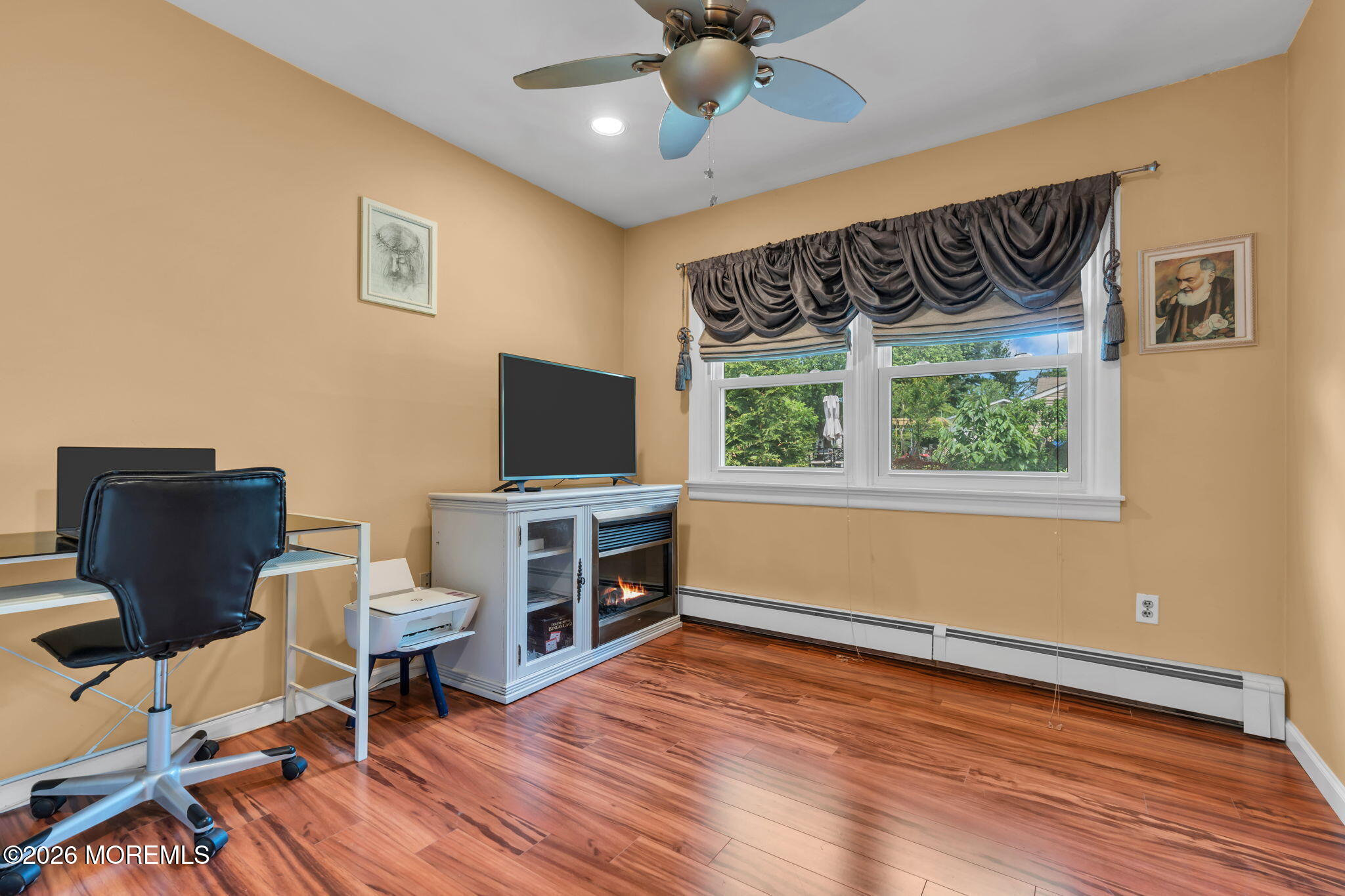 8 Owens Road Marlboro, NJ 07746 - Photo 24 of 39 a view of a livingroom with furniture and a flat screen tv