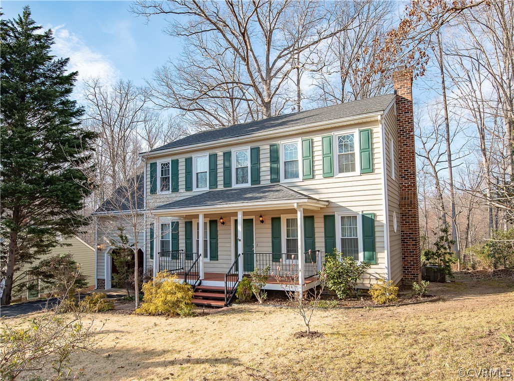 2312 Brookforest Road Midlothian, VA 23112 - Photo 1 of 39 a front view of a house with a yard covered with snow and plants
