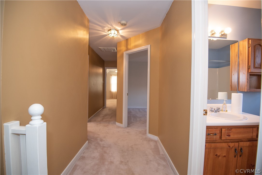 2312 Brookforest Road Midlothian, VA 23112 - Photo 26 of 39 a bathroom with a sink and a mirror