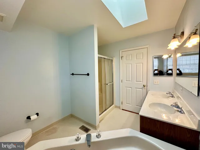 a bedroom with a bed and a view of bathroom
