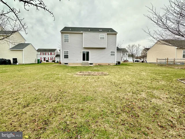 a house view with swimming pool in front of it