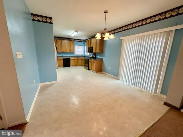 a view of a kitchen with furniture and a kitchen view