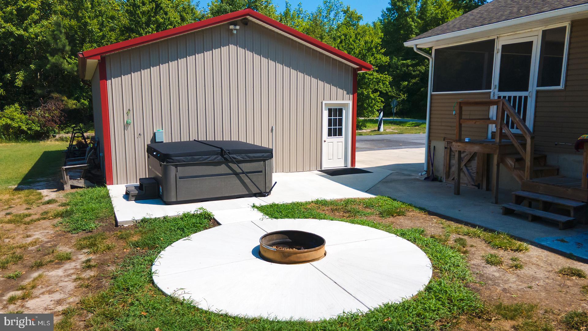 14298 South Union Church Road Ellendale, DE 19941 - Photo 45 of 62 New patio w/ firepit & hot tub electric connection