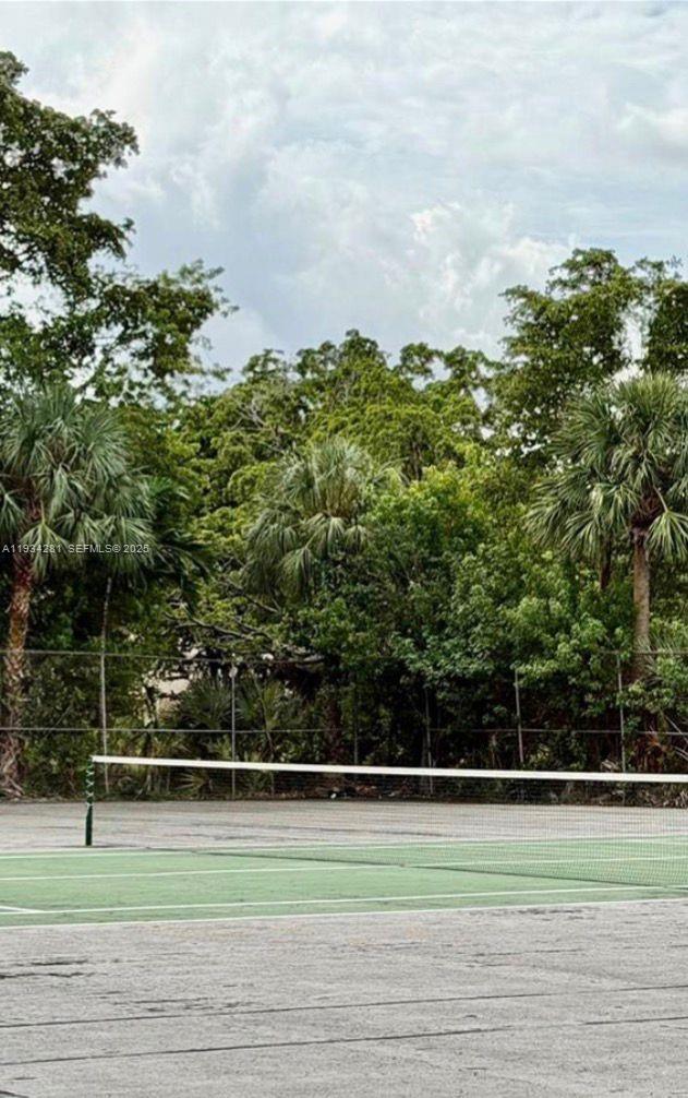 4803 Northwest 7th Street, Unit 21014 Miami, FL 33126 - Photo 11 of 15 a view of a tennis court