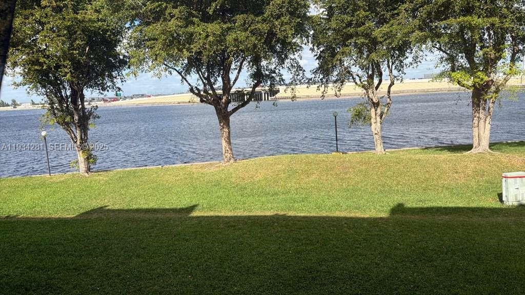 4803 Northwest 7th Street, Unit 21014 Miami, FL 33126 - Photo 2 of 15 a view of a yard with a tree