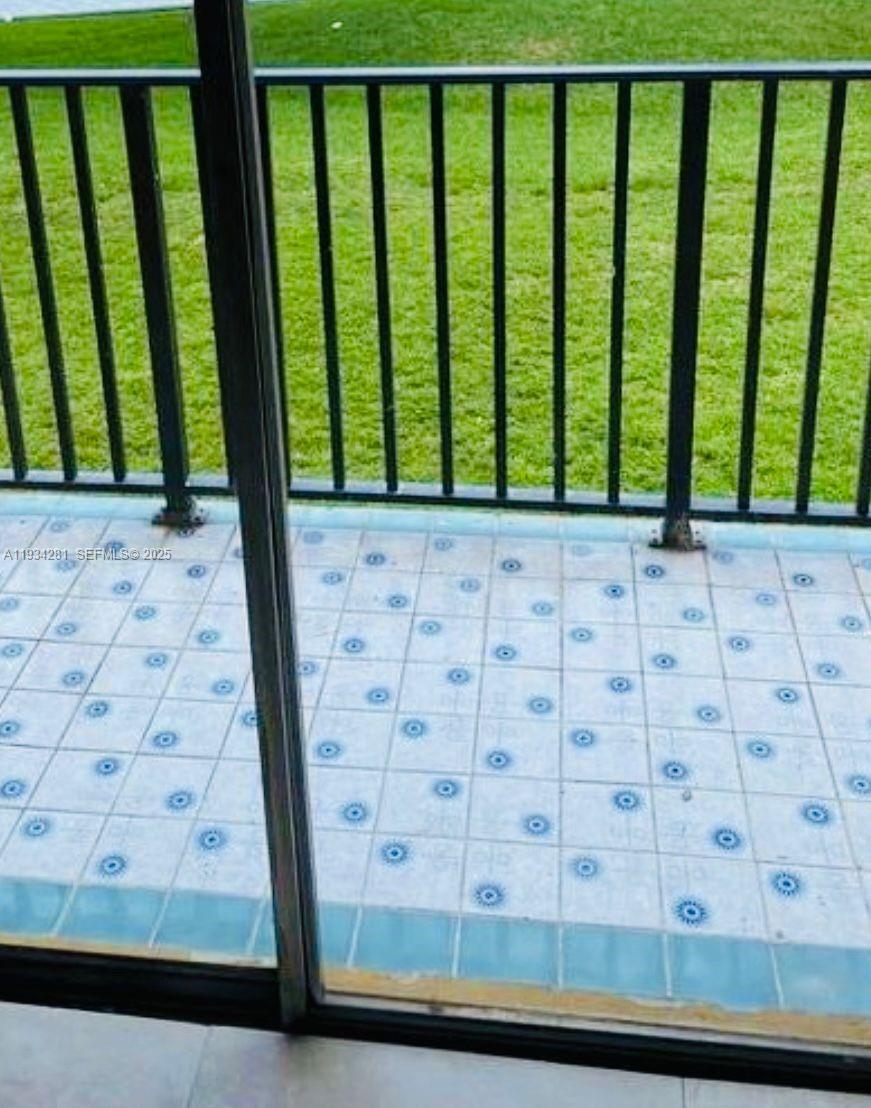 4803 Northwest 7th Street, Unit 21014 Miami, FL 33126 - Photo 3 of 15 a view of a porch