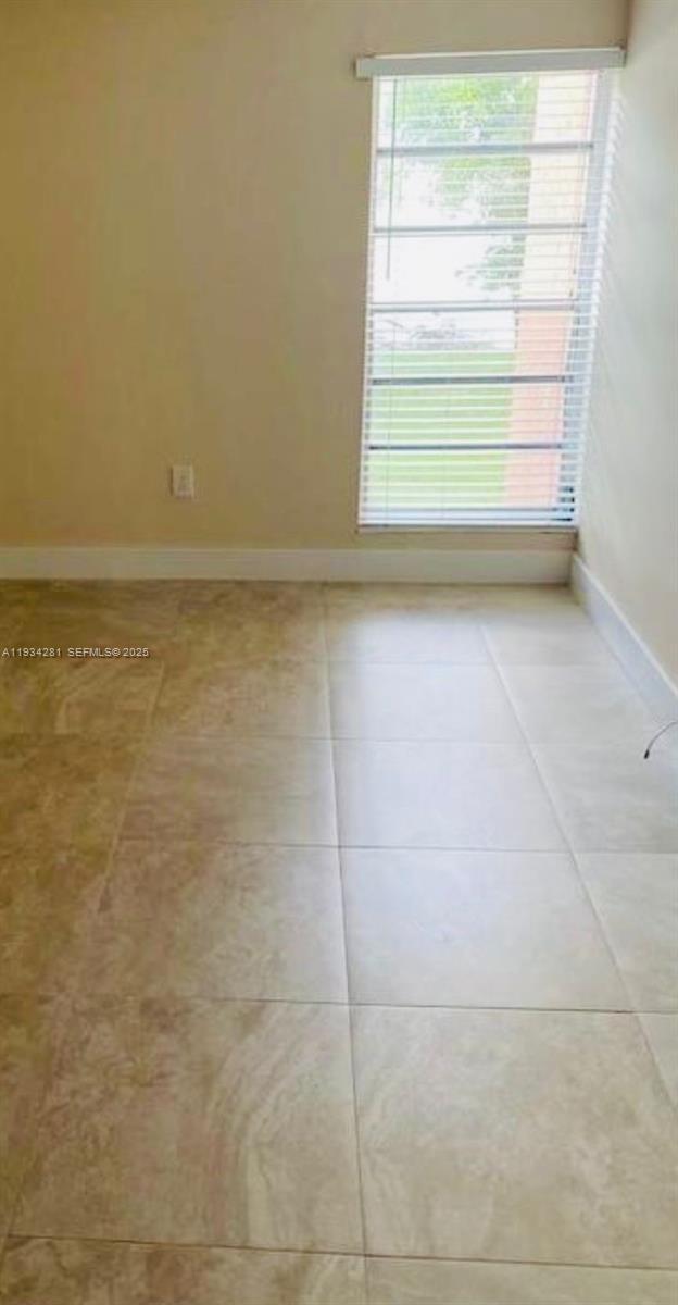 4803 Northwest 7th Street, Unit 21014 Miami, FL 33126 - Photo 9 of 15 a view of room with window