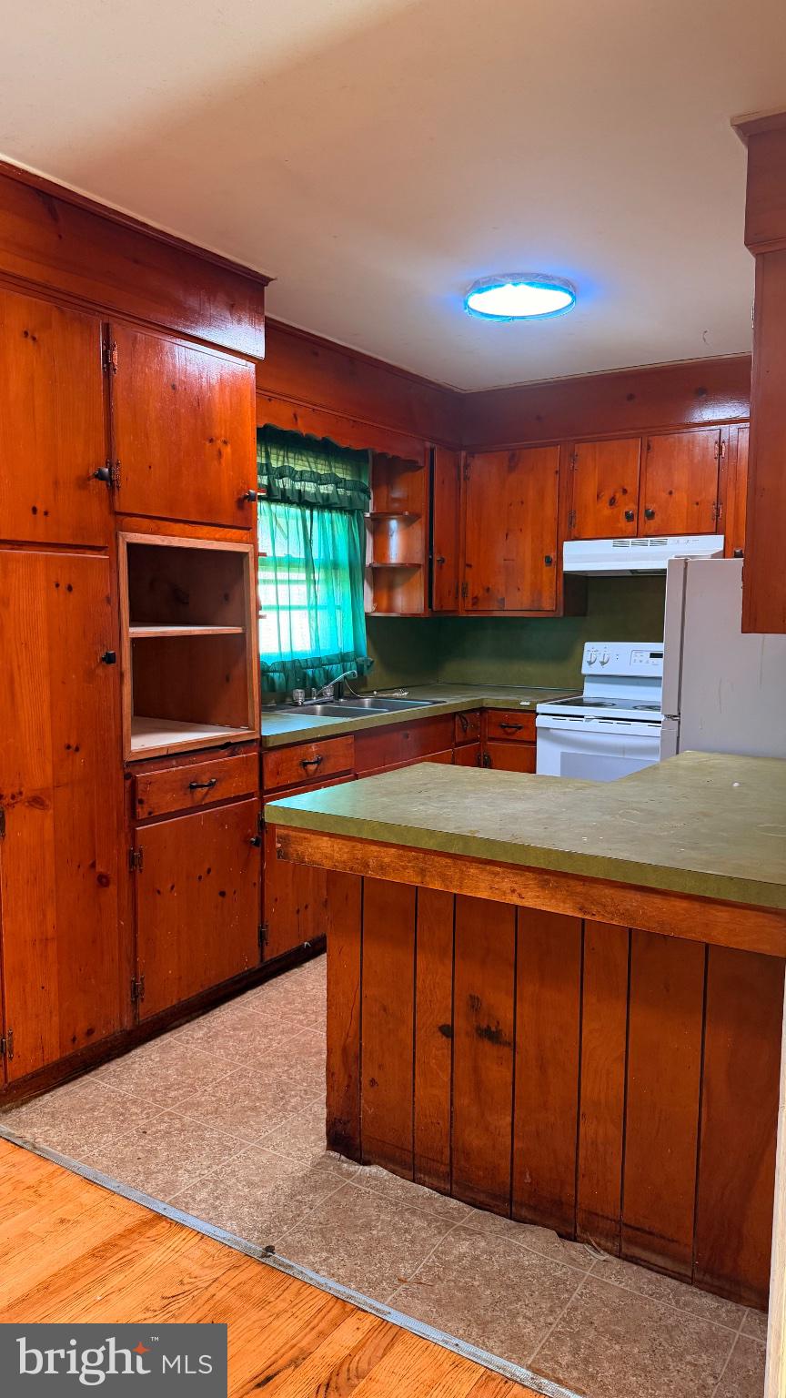 711 Rigby Avenue Cambridge, MD 21613 - Photo 9 of 21 Charming vintage kitchen with wood accents.