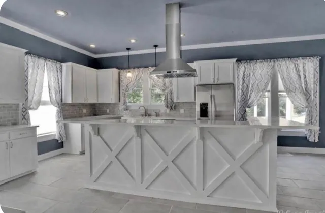 a kitchen with a sink cabinets and window