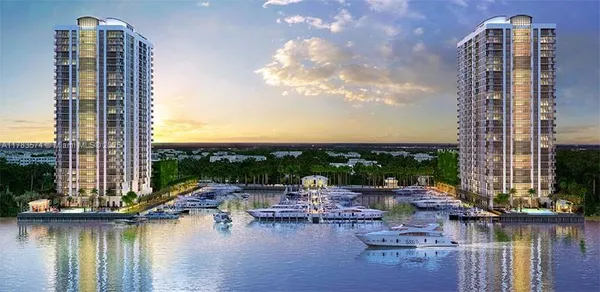 a view of a lake with tall buildings