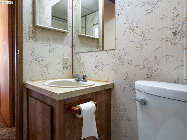 a bathroom with a sink and mirror