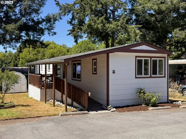 a front view of a house with a garage