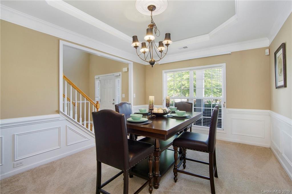 10529 Greenhead View Road Charlotte, NC 28262 - Photo 13 of 32 a view of a dining room with furniture window and wooden floor