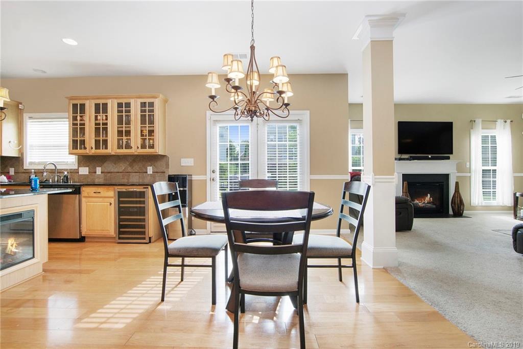 10529 Greenhead View Road Charlotte, NC 28262 - Photo 14 of 32 a view of a dining room with furniture window and wooden floor
