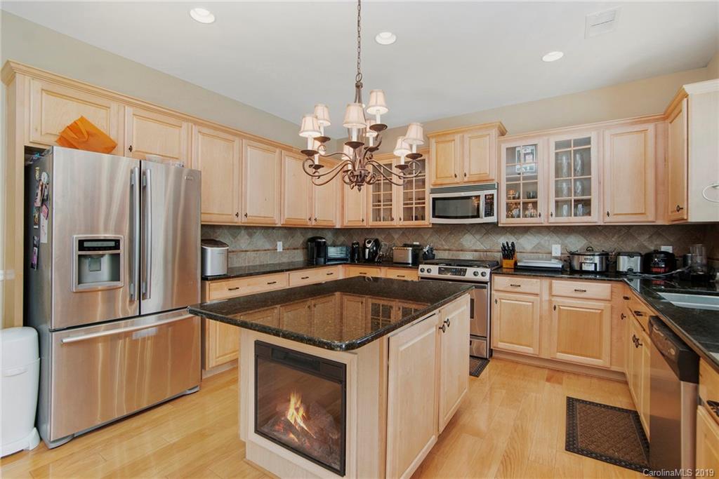 10529 Greenhead View Road Charlotte, NC 28262 - Photo 16 of 32 a kitchen with stainless steel appliances granite countertop a sink stove and refrigerator