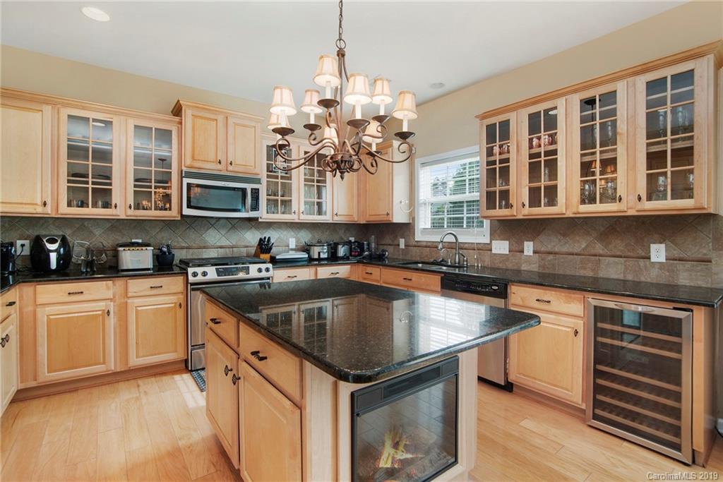 10529 Greenhead View Road Charlotte, NC 28262 - Photo 17 of 32 a kitchen with stainless steel appliances granite countertop a stove and a sink