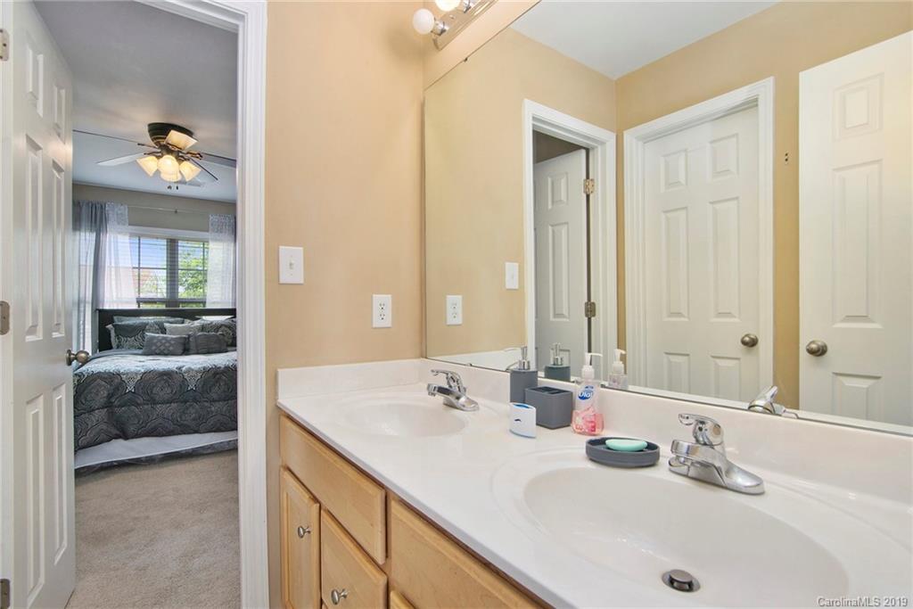 10529 Greenhead View Road Charlotte, NC 28262 - Photo 23 of 32 a bathroom with a sink double vanity and a mirror