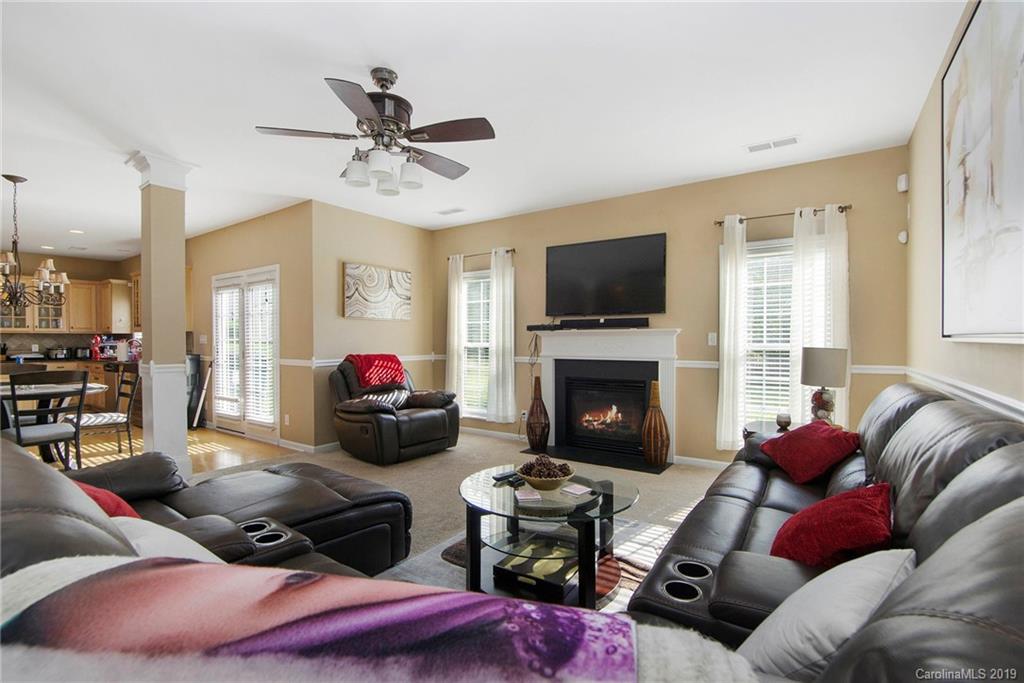 10529 Greenhead View Road Charlotte, NC 28262 - Photo 6 of 32 a living room with furniture fireplace and a flat screen tv