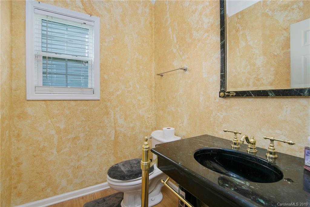 10529 Greenhead View Road Charlotte, NC 28262 - Photo 10 of 32 a bathroom with a sink and a toilet