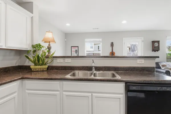 a kitchen with a sink and cabinets