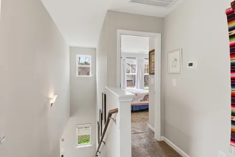 a view of a bedroom from a hallway