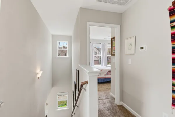 a view of a bedroom from a hallway