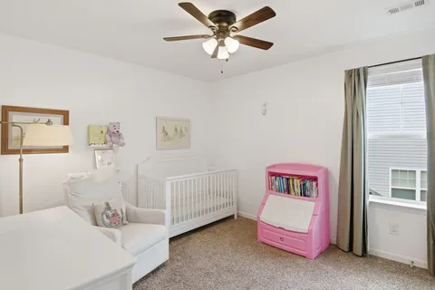 a bedroom with furniture and a chandelier