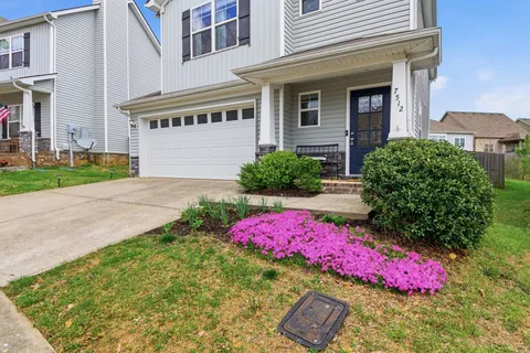a front view of a house with yard
