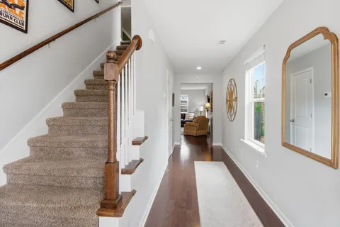 a view of a room with stairs and a couch
