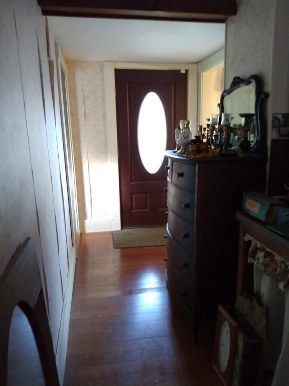 7 Maple Place Winchendon, MA 01475 - Photo 6 of 28 a view of a hallway with wooden floor and glass windows