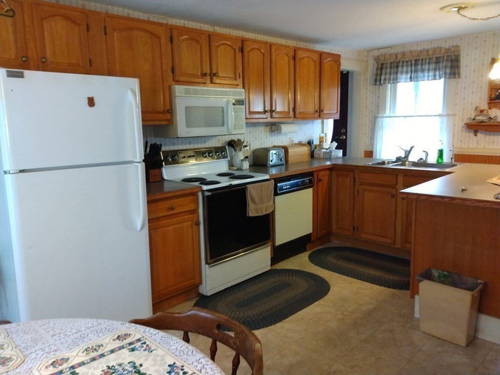 7 Maple Place Winchendon, MA 01475 - Photo 7 of 28 a kitchen with a refrigerator sink and cabinets