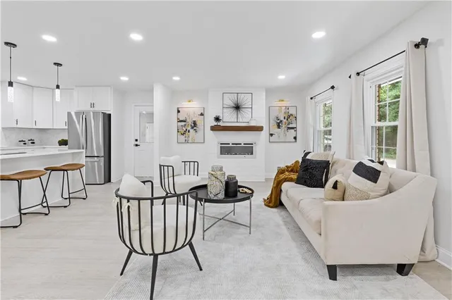 a living room with furniture and a large window