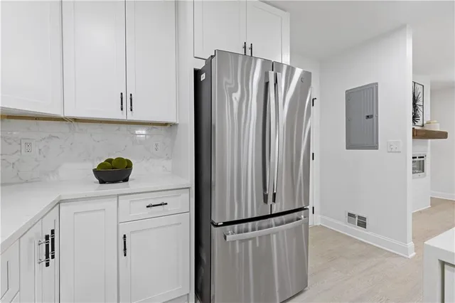 a kitchen with appliances and cabinets