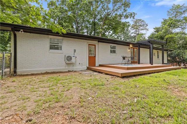 a house with trees in the background