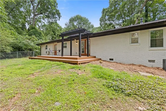 a front view of a house with a yard table and chairs