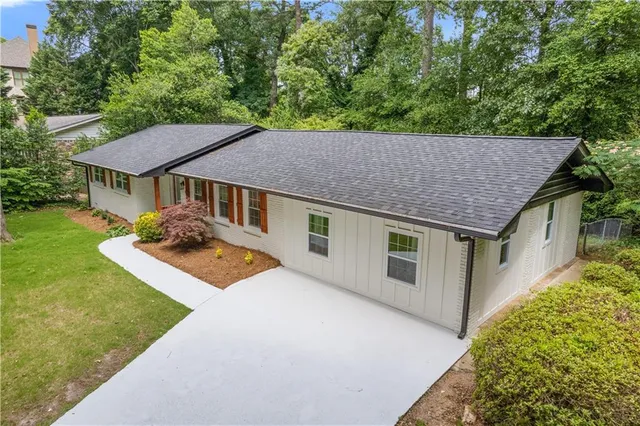 front view of a house with a yard
