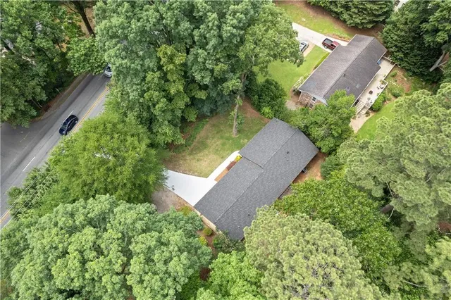 an aerial view of a house with outdoor space and street view