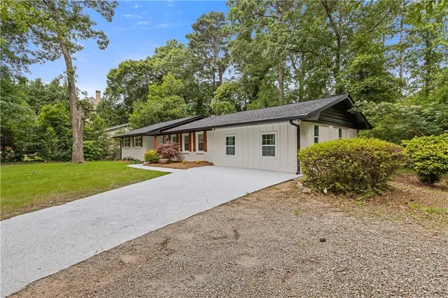 a house with trees in the background