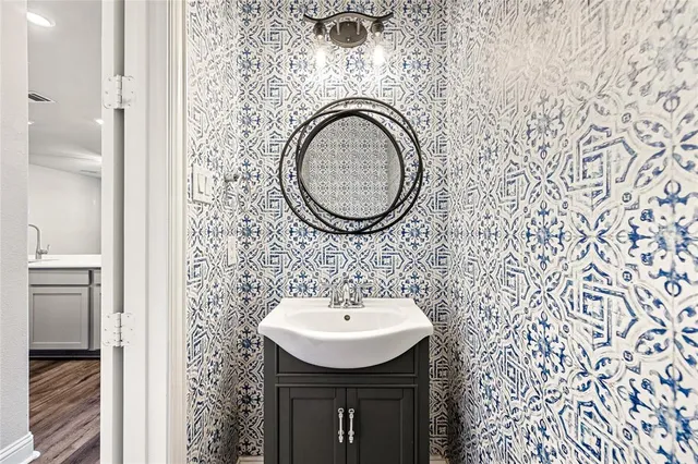 a view of kitchen with stainless steel appliances granite countertop cabinets