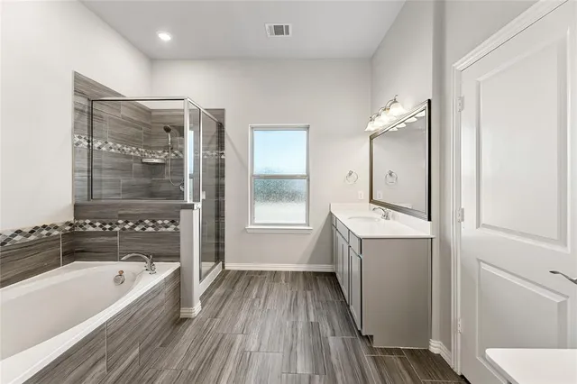 a bathroom with a sink double vanity and a mirror