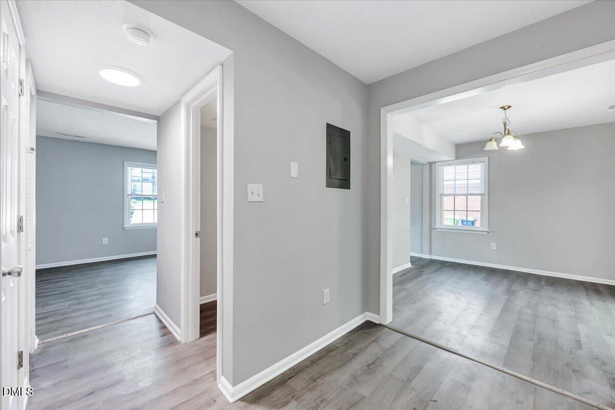 3408 Atlantic Avenue Raleigh, NC 27604 - Photo 31 of 48 an empty room with wooden floor and windows