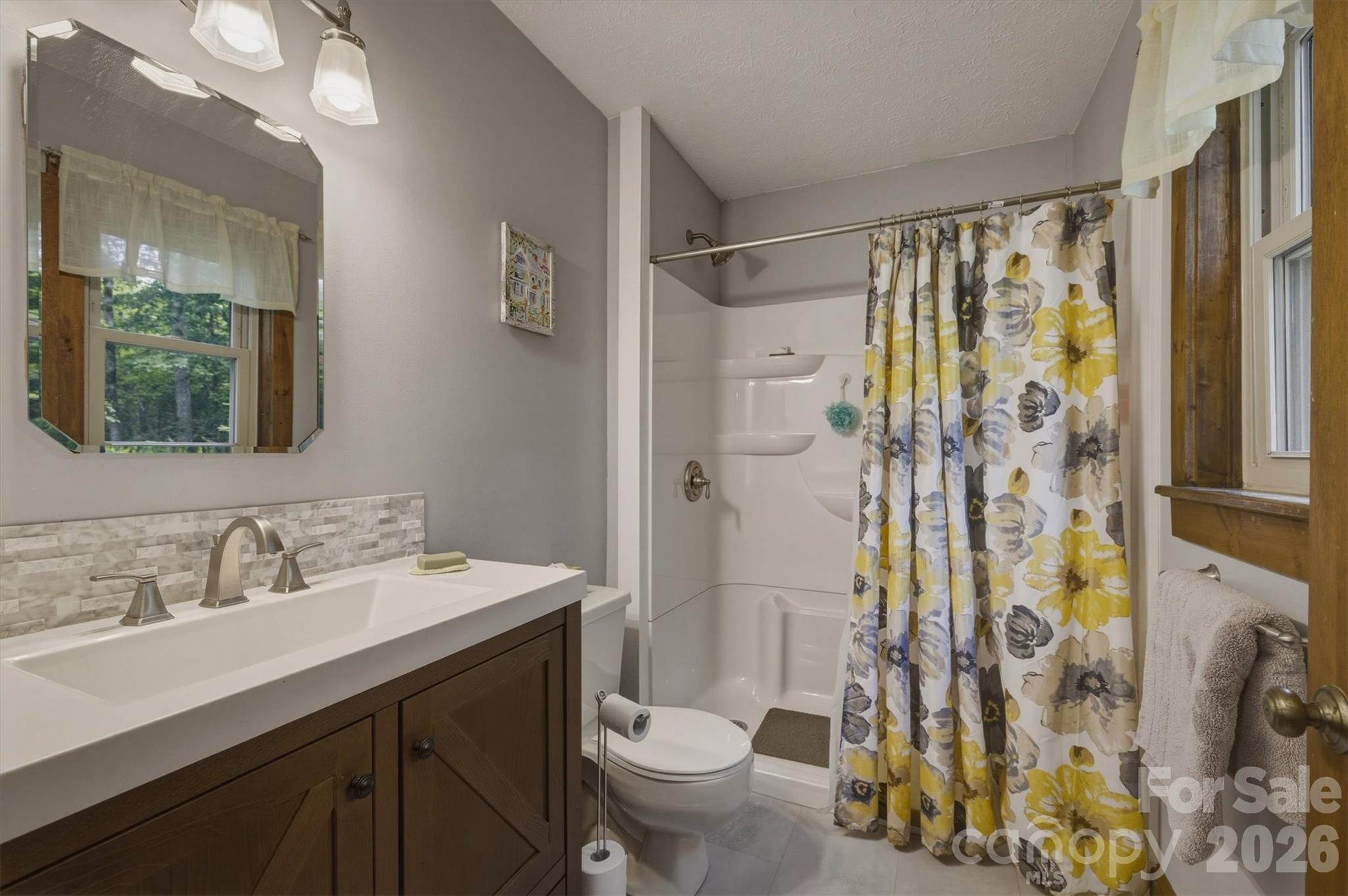 3432 Ridgewood Drive Morganton, NC 28655 - Photo 19 of 36 a bathroom with a sink toilet and shower