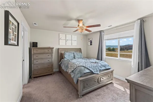 a bed room with a bed and a window