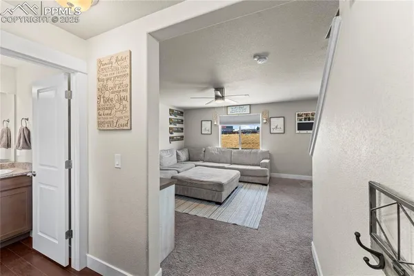 a bedroom with furniture and a book shelf